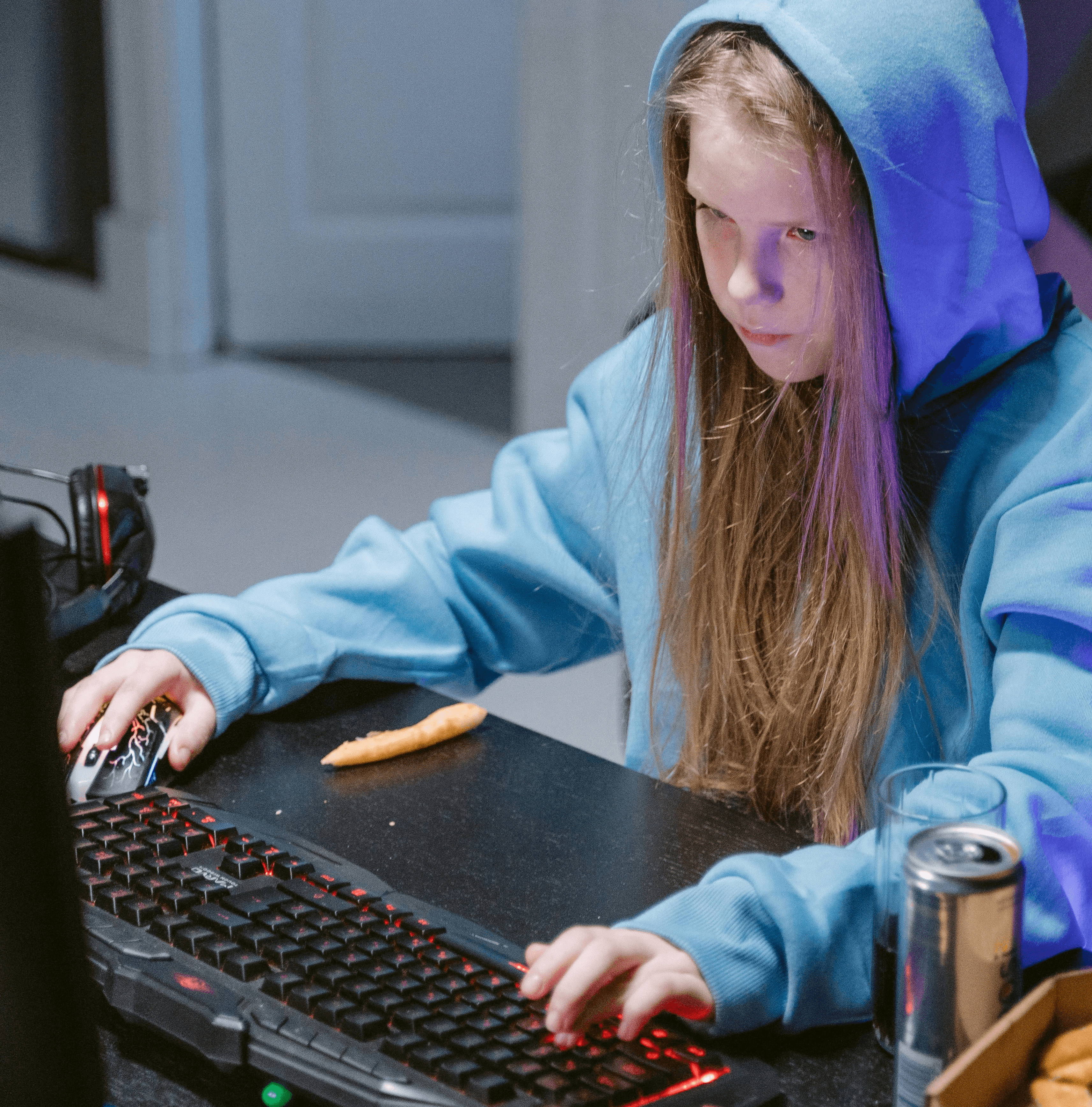 Person playing games and has a dirty desk